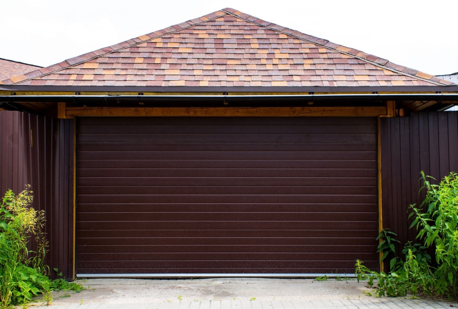Garage door repair Portland common issues infographic showing broken springs, misaligned sensors, and off-track doors